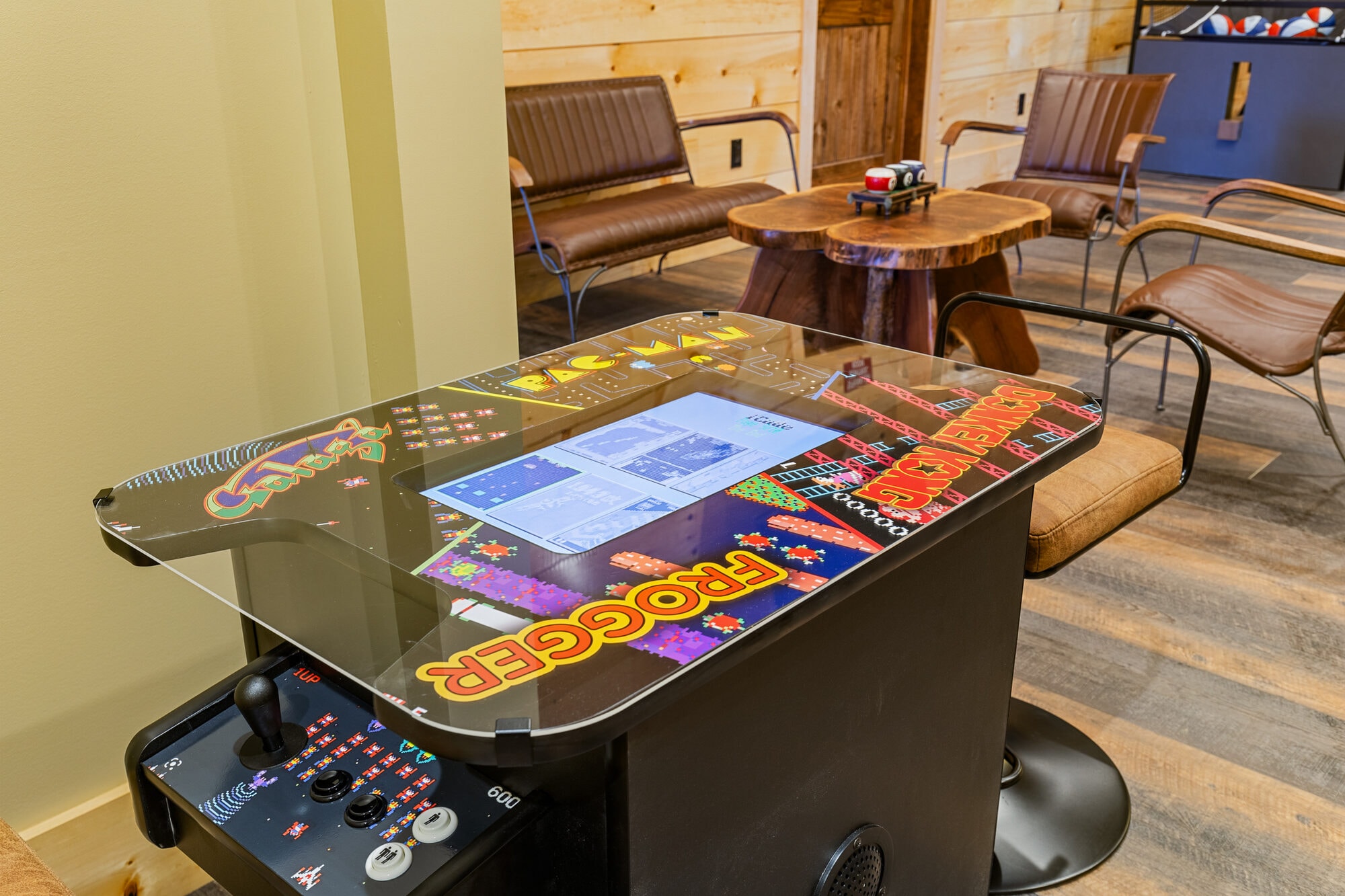 Excalibur multi-game arcade table Pac-Man Frogger Galaga leather lounge seating