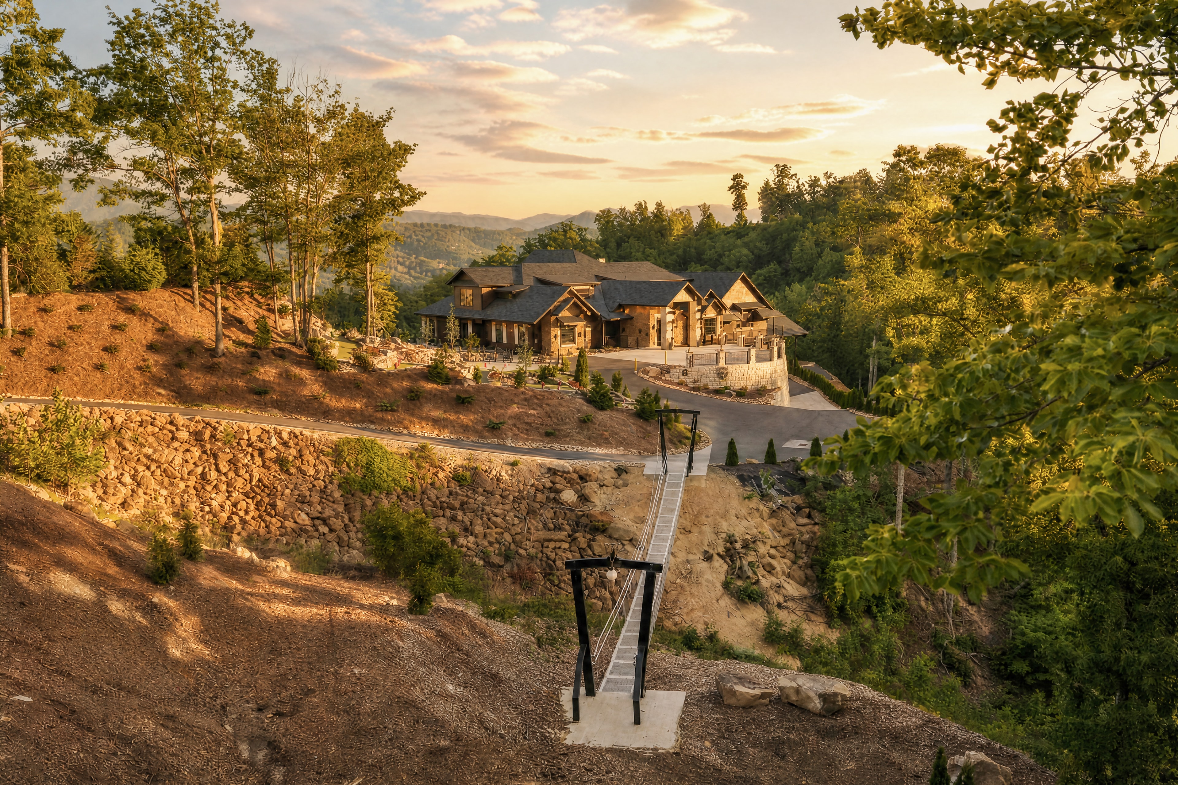 Aerial golden-hour view of Excalibur lodge from the Summit Nature Trail staircase, Smoky Mountains
