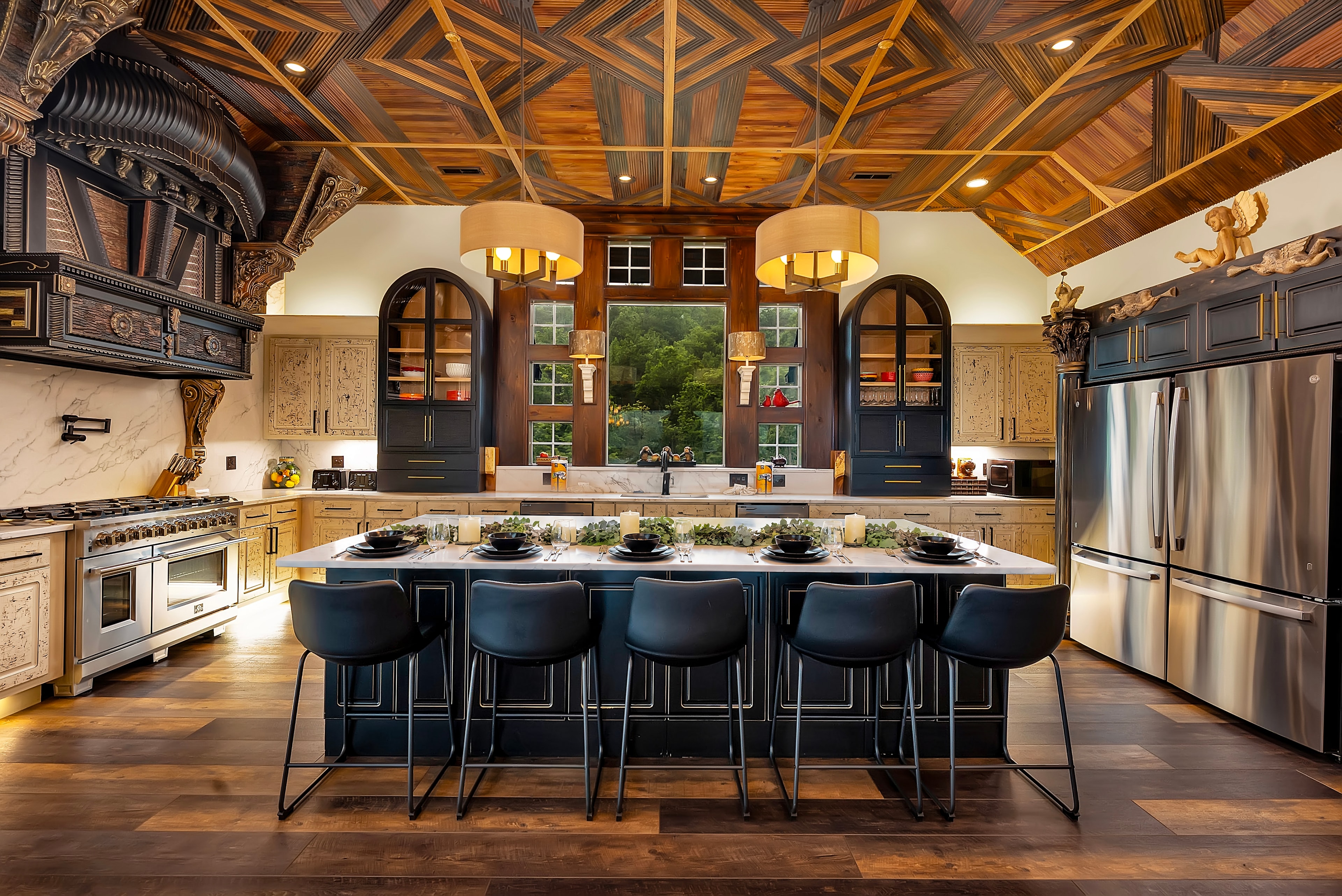 Excalibur gourmet kitchen staged with geometric wood ceiling and large island seating