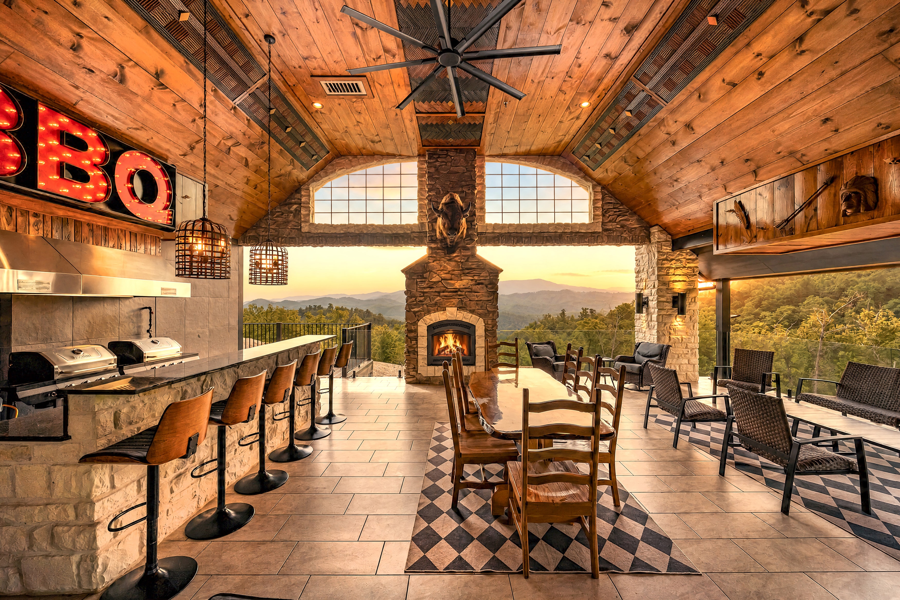 Excalibur covered outdoor pavilion with stone fireplace and mountain views