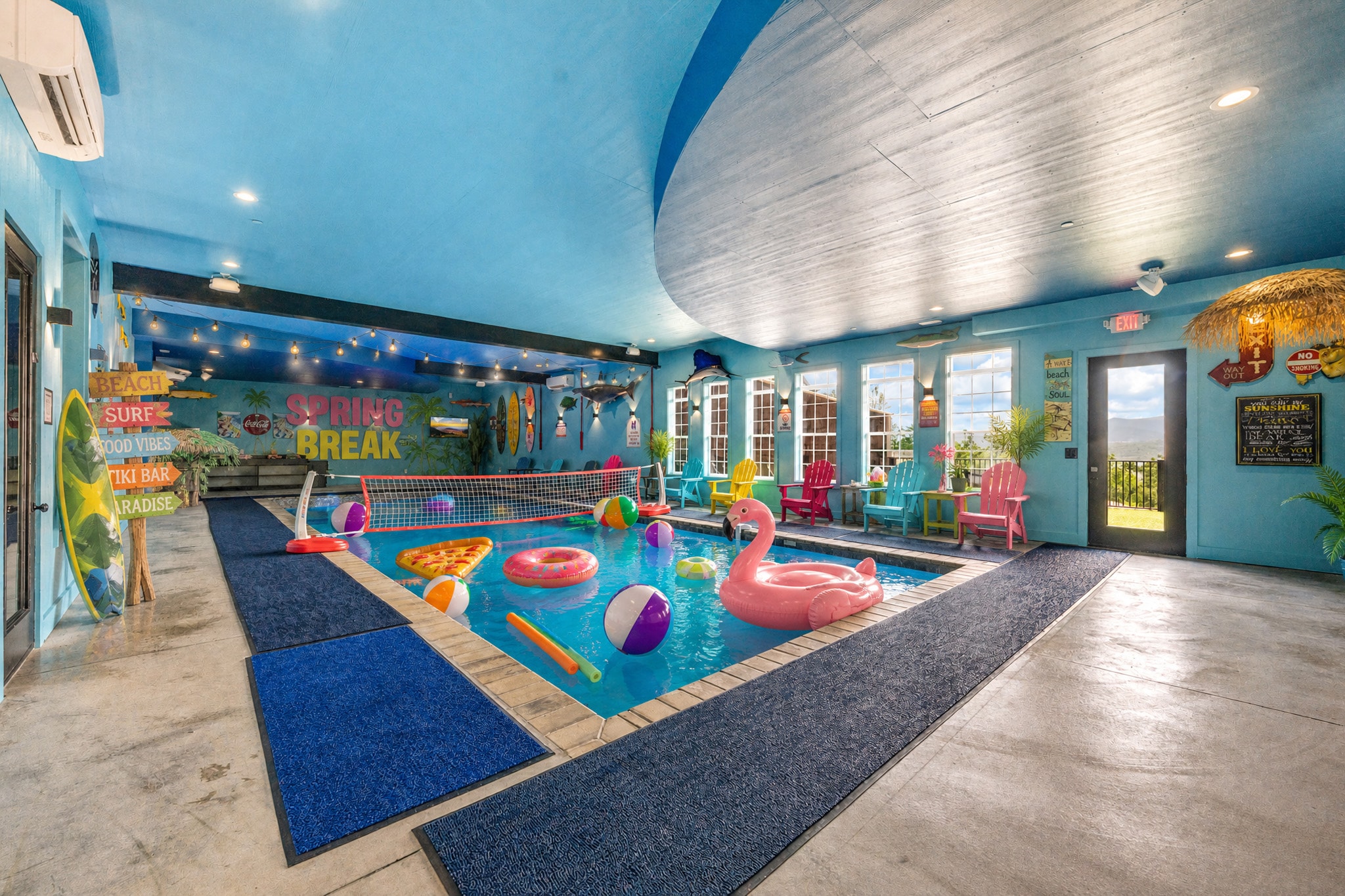 Excalibur indoor pool spring break flamingo floats beach balls tiki bar decor Smoky Mountains