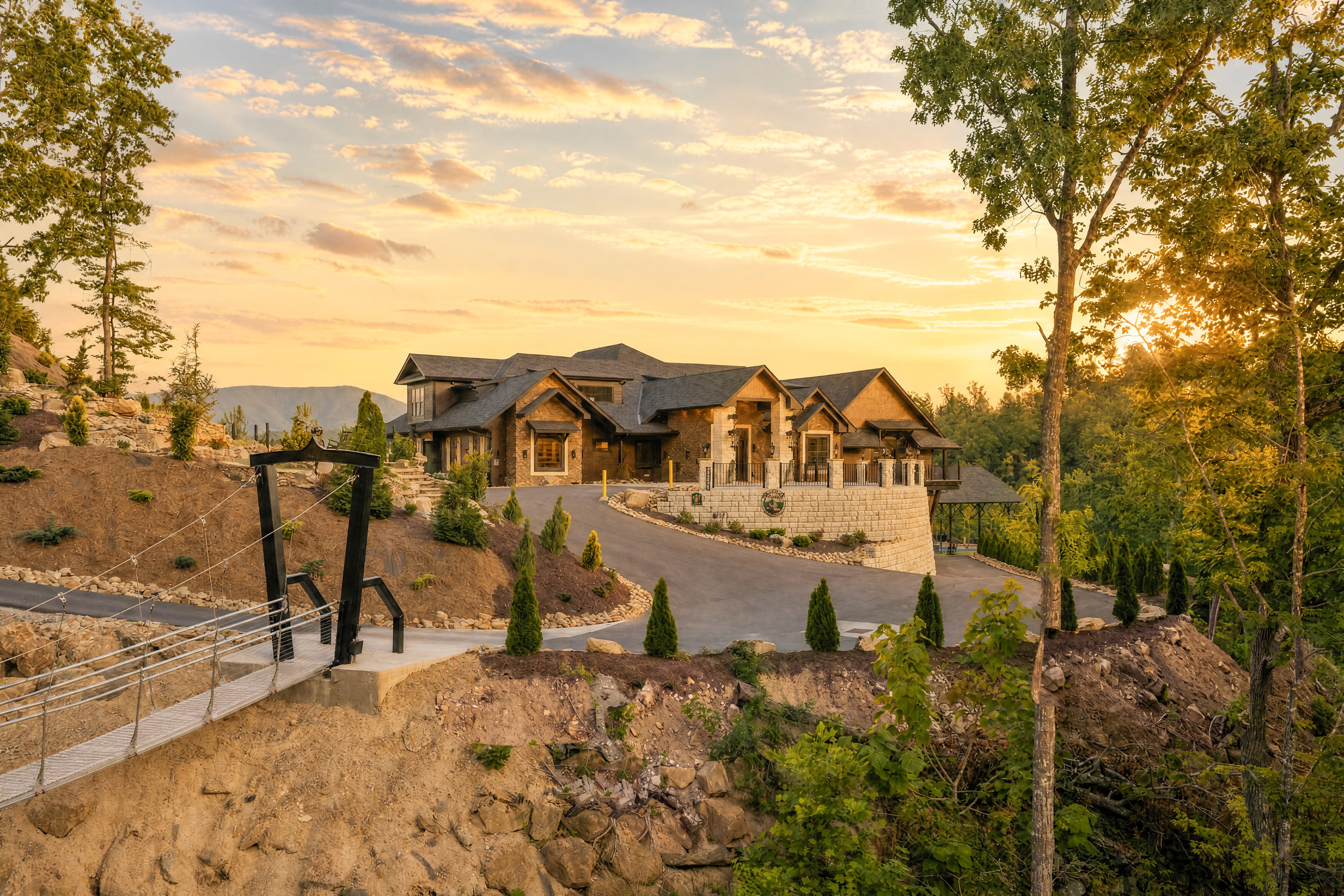 Excalibur luxury lodge exterior golden hour sunset Smoky Mountains skybridge foreground